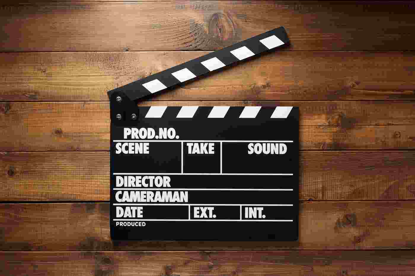 Film Movie Clapper Board At Wooden Background KNZYQUX